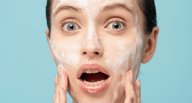 Woman washing face with cleanser, do you really need to double cleanse skin, Parisians Pure Skincare, Kelli Parisian